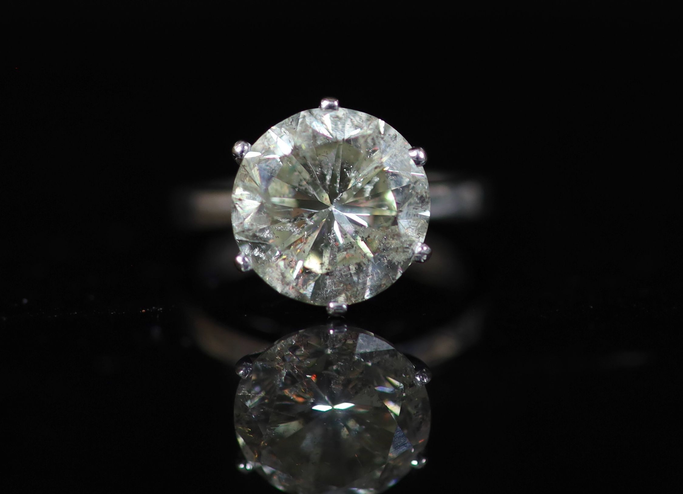 A modern 18ct white gold and solitaire diamond ring